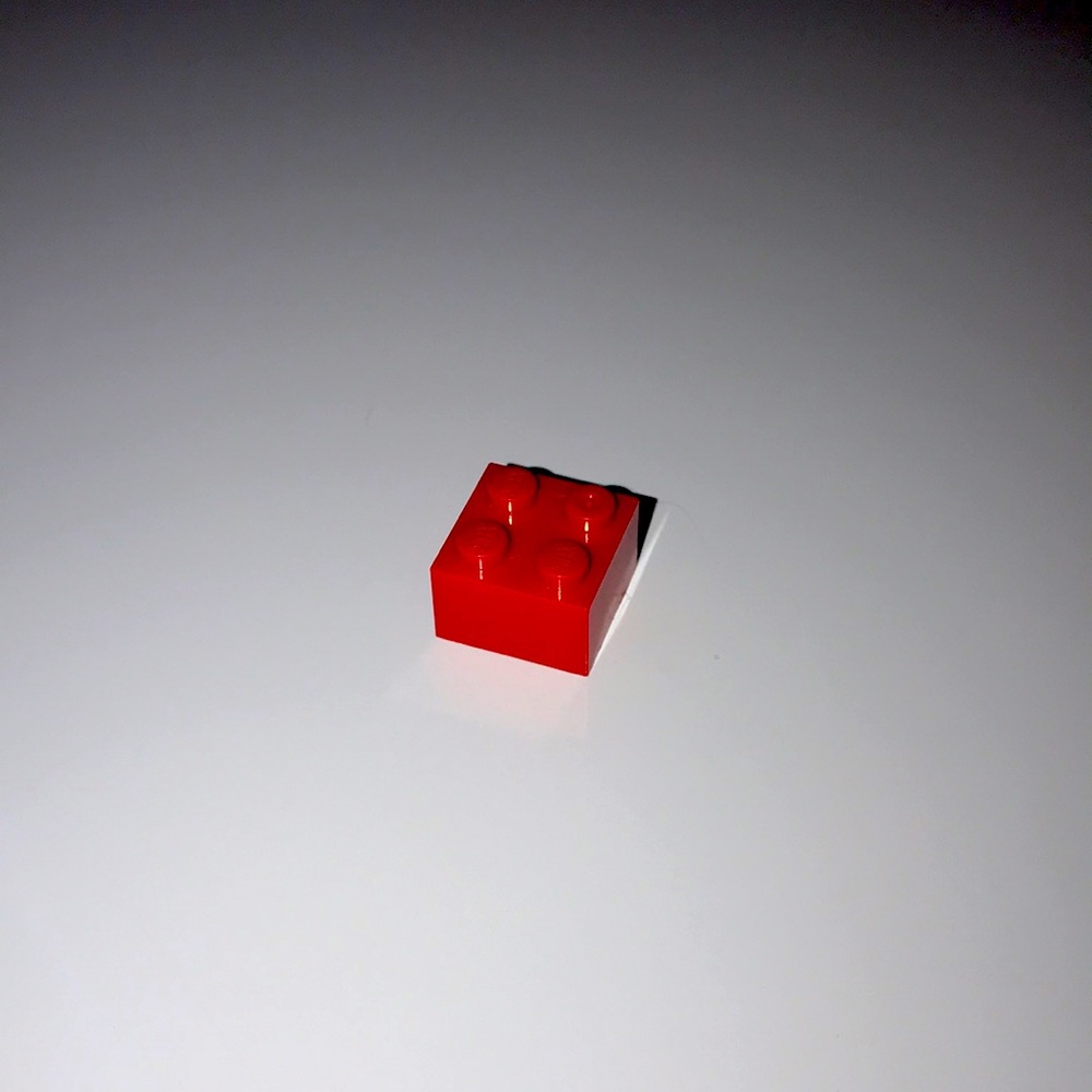 an ordinary lego brick (red)